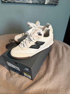 New Balance Cream Sneakers with Black Logo